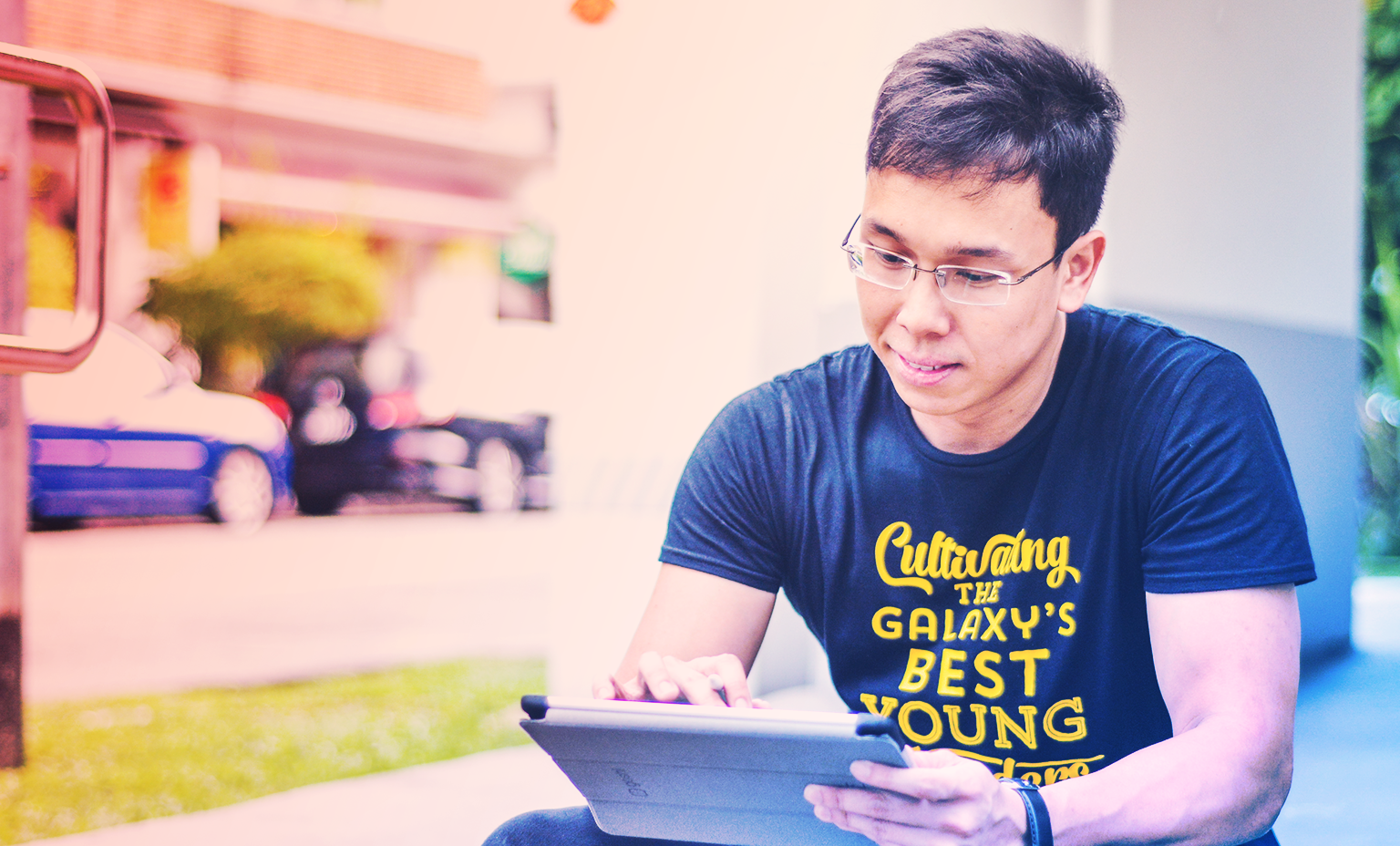Surviving a Startup Environment: Mentoring aspiring changemakers - Khairul Rusydi on his tablet